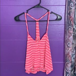 Neon pink tank top.